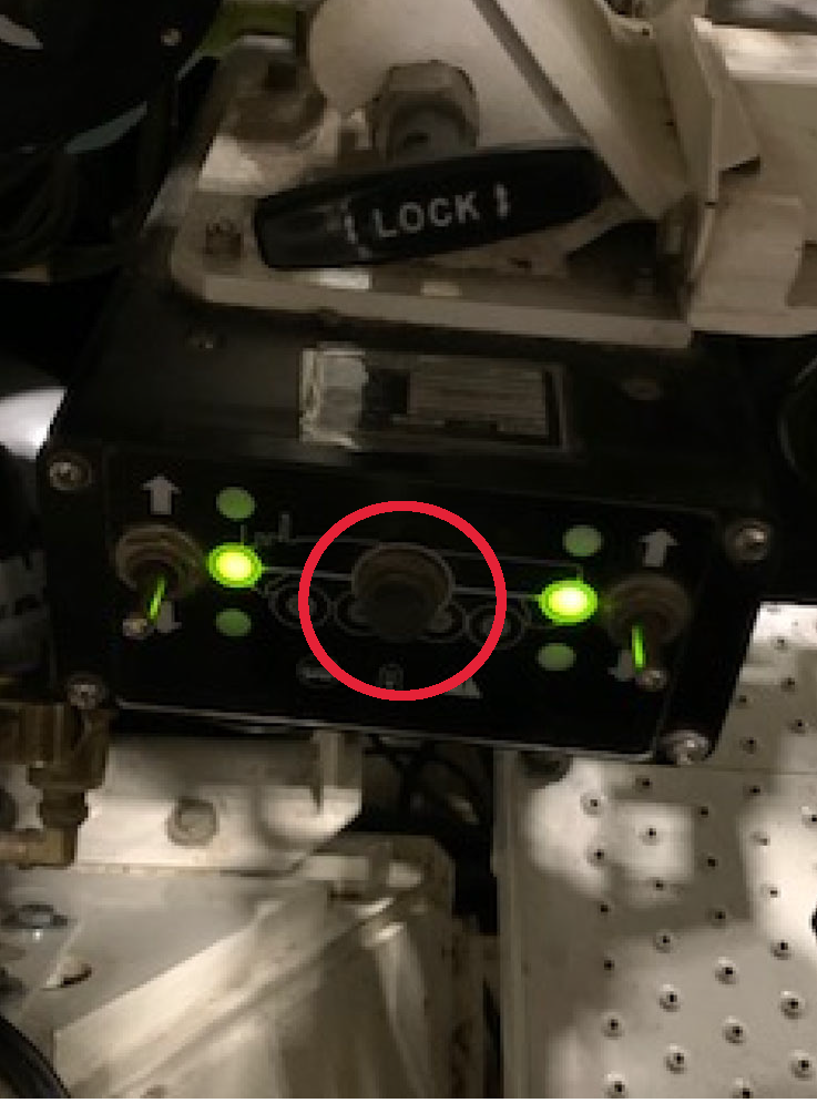 Depress center button on HMU